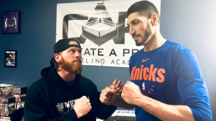 Curt Hawkins battles New York Knicks Center Enes Kanter in impromptu match