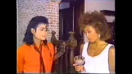 Whitney Houston presenting an award to Michael Jackson