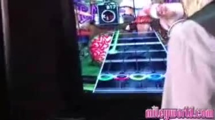 Miley Cyrus - Having Fun and playing Guitar Hero