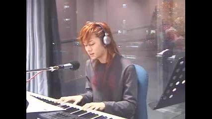 Heechul playing the paino and singing