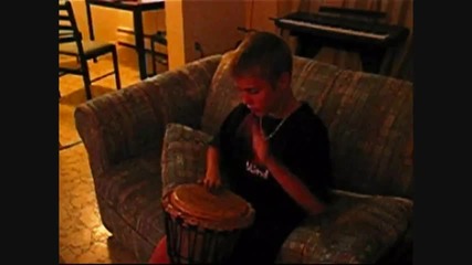 Justin Bieber playing the djembe