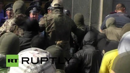Ukraine: Fists fly as masked men storm Kharkov city hall
