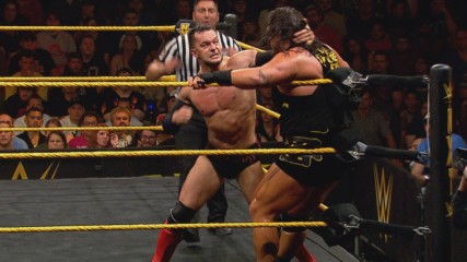 Finn Bálor soars over the top rope crushing Rhyno: WWE NXT, June 3, 2015 (WWE Network Exclusive)