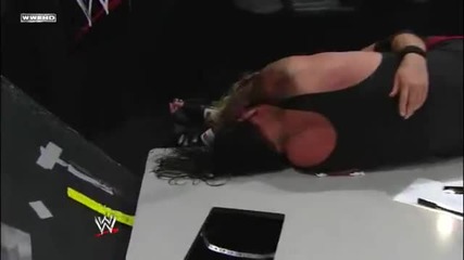Edge Spears The Undertaker through the Announcer Table