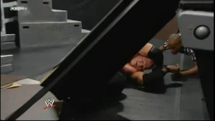 Edge Spears Kane through a Table