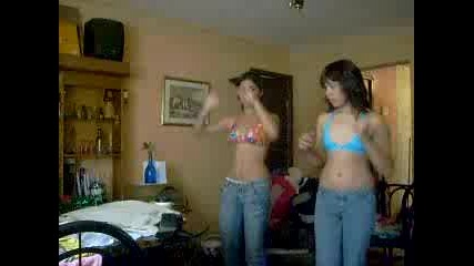 two girls dancing in bikinis