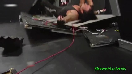 Big Show Chokeslams Undertaker Through Announce Table