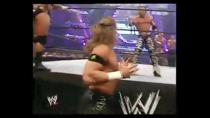 shawn micheals puts his arm round melina 