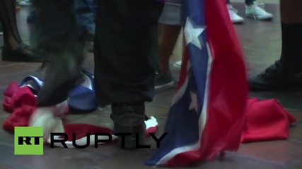 USA: Confederate flag rally met by counter-protesters burning flag
