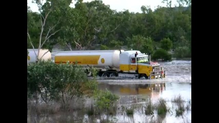 Shell Road Train Crossing a Flooded River