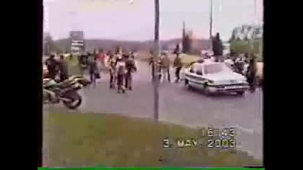 Motorcycle Slams into Police Car 