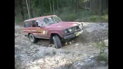 60 series landcruiser on rutted hill