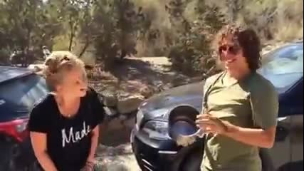 Barcelona legend Carles Puyol helps an attractive blonde do the Als challenge in Ibiza