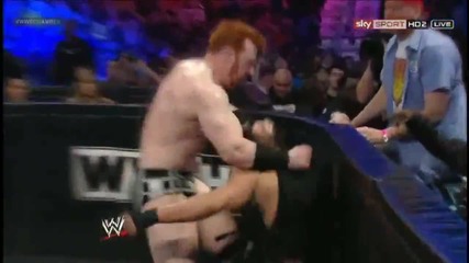 Roman Reigns Spears Sheamus through the barricade