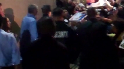 Justin Bieber wearing a fedora hat loving his screaming fans outside Jimmy Kimmel Live!