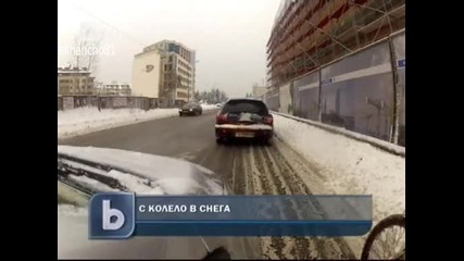 С колело в снега