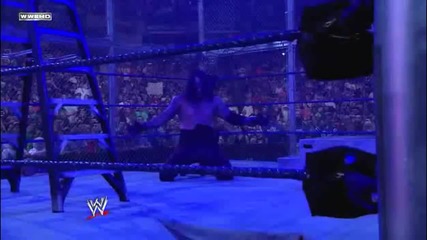 Undertaker Chokeslams Edge through the ring