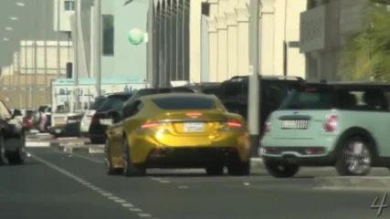 Gold Aston Martin Dbs - Driving By