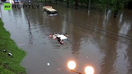 Eight Men Try to Save Auto From Flash Flood