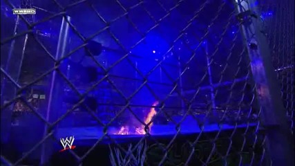 Undertaker Chokeslams Edge through the ring