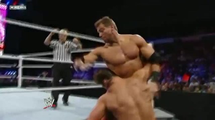 Drew Mcintyre Spinebusters Zack Ryder into the ring apron