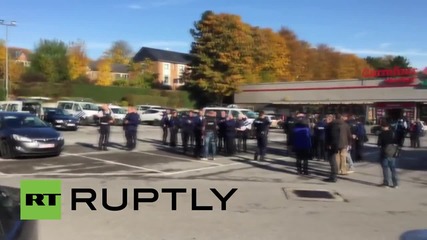 Belgium: Manhunt underway after masked man crashes car into barracks
