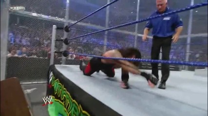 Super Chokeslam through two Tables