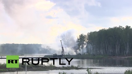 Russia: Amphibious units launch mock assault across lake amid gunfire