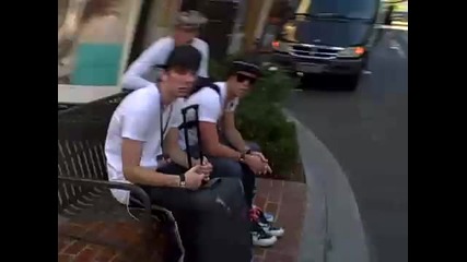 White T and my hat on a bench