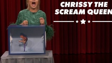 Watch Chrissy Teigen get bitten by a dinosaur