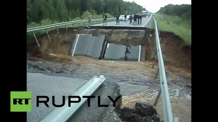 Russia: Road bridge collapses due to heavy rain in Tyumen