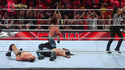 AJ Styles uses the momentum of Mustafa Ali’s 450 Splash to hit a devastating Styles Clash