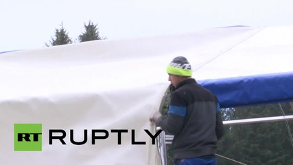 Austria: Refugees wait to cross into Germany as temperatures drop