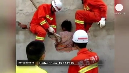 China- wall woman rescued - no comment