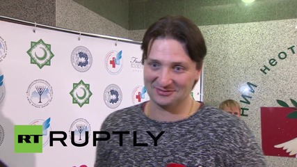 Russia: Tiger brought to meet child injured in Ukraine conflict