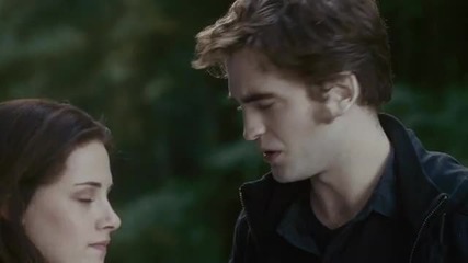Edward and Bella kiss in front of shirtless Jacob 