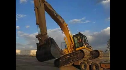 Loading An Excavator To Lowboy.flv