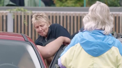 Two Sumo Wrestlers try to get into a Ford Focus