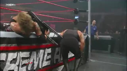Edge counters a Guillotine Leg Drop with a Chair