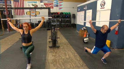 Becky Lynch shows a WWE Universe member how she does CrossFit