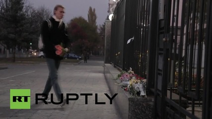 Ukraine: Plane crash mourners place flowers outside Russian embassy in Kiev