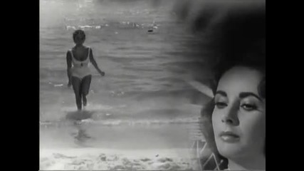Liz Taylor In Lovely Loose Swimsuit At The Beach 