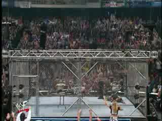 Wwe - Jeff Hardy Скача От Клетка Върху Маса